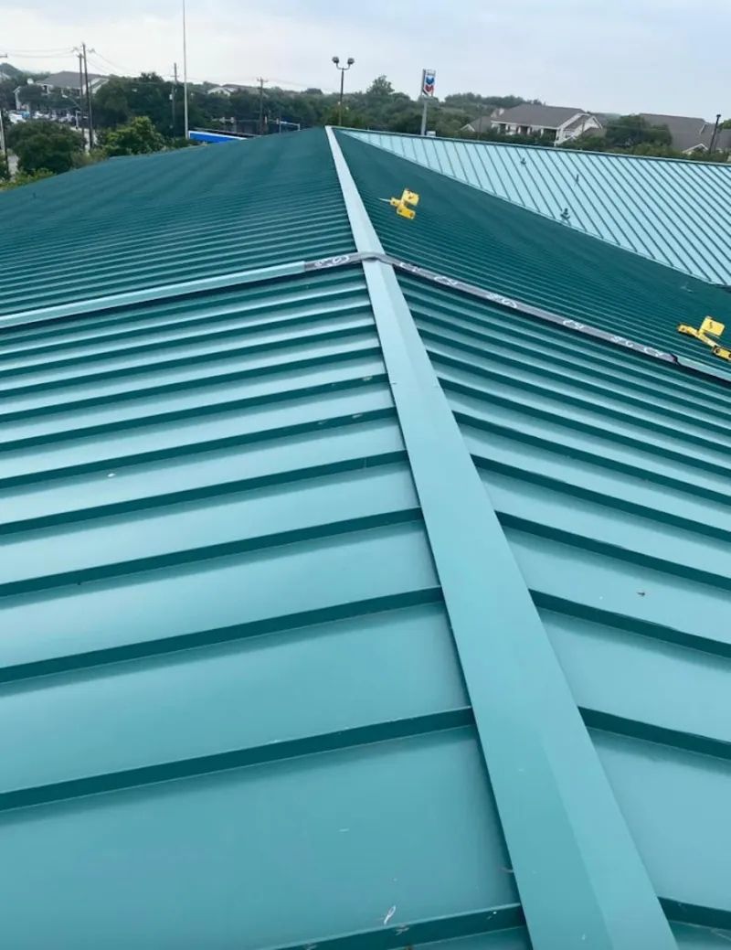 Green commercial metal roof ridge and valley for Metal Roof Repair in Little Falls